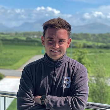 David Wylie smiling with beauting blue sky's in the background